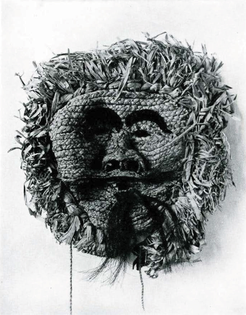 Corn husk woven mask with eyebrows of black cloth, mustache and beard of horsehair.