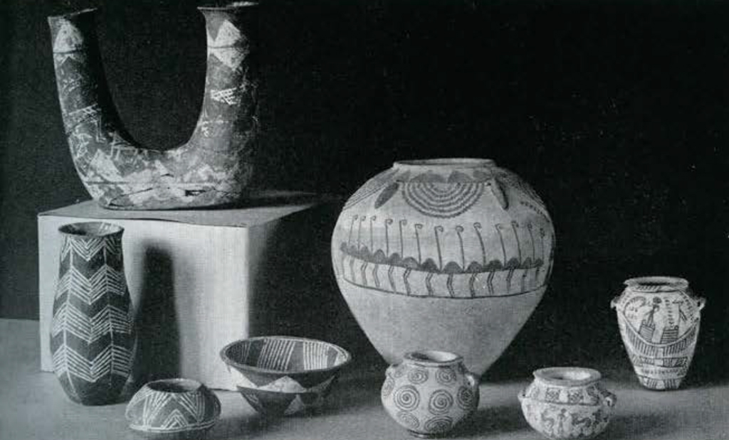 Eight pieces of pottery vases in different shapes with red and white decoration in geometric patterns and some with scenes from daily light, including hunting animals.