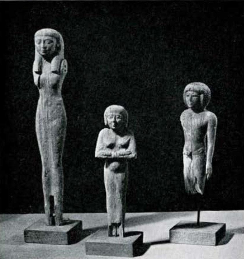 Three wooden statuettes.