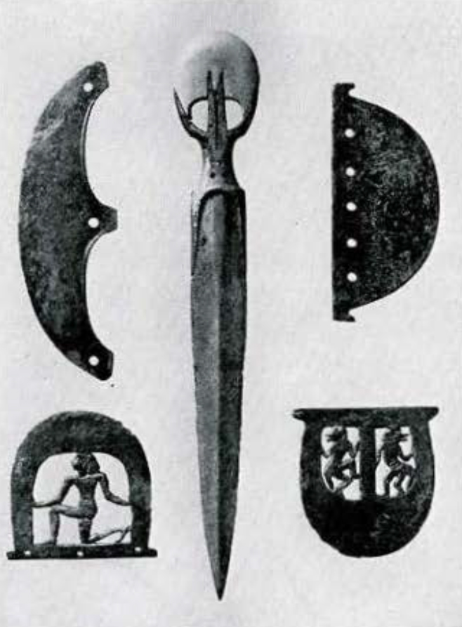 A dagger and four axe blades, two with figures carved into them.