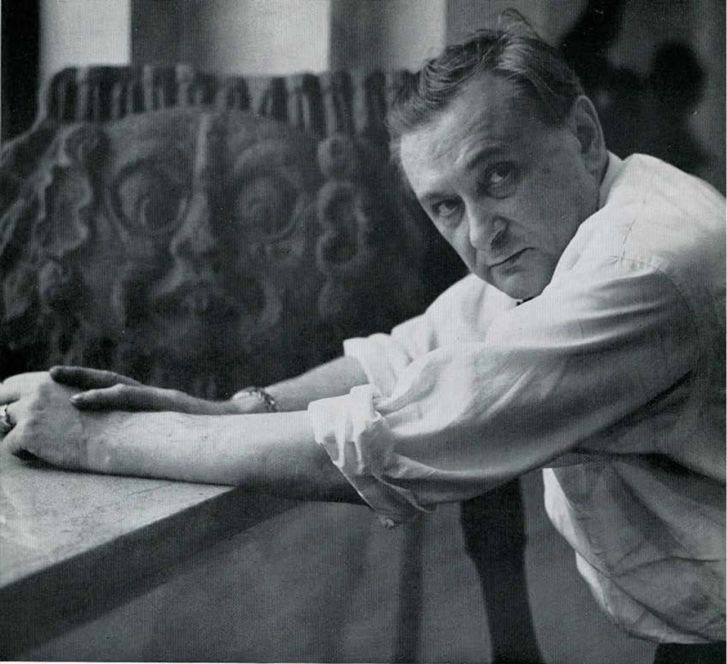 Jacques Lipchitz with a stone relief.