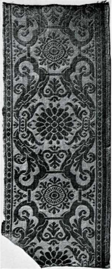 Damask of a symmetrical diesng with a floral motif.
