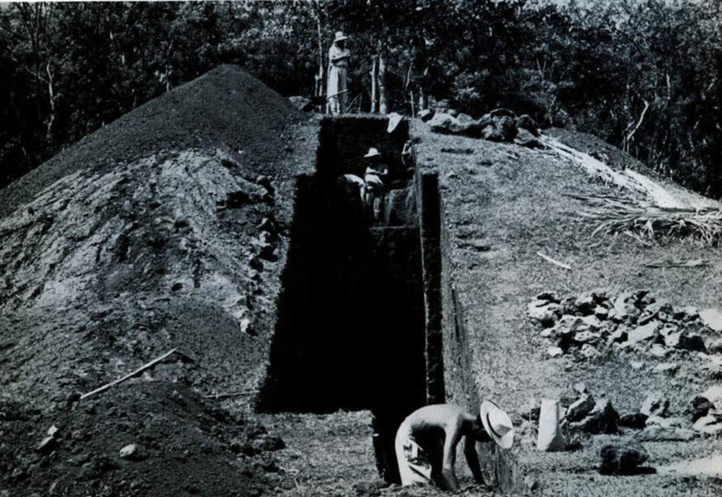 Mound 3 with large trench dug in the middle, men working.