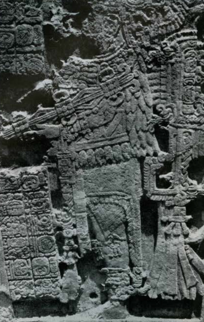 Close up of priest carving on a stone stela.