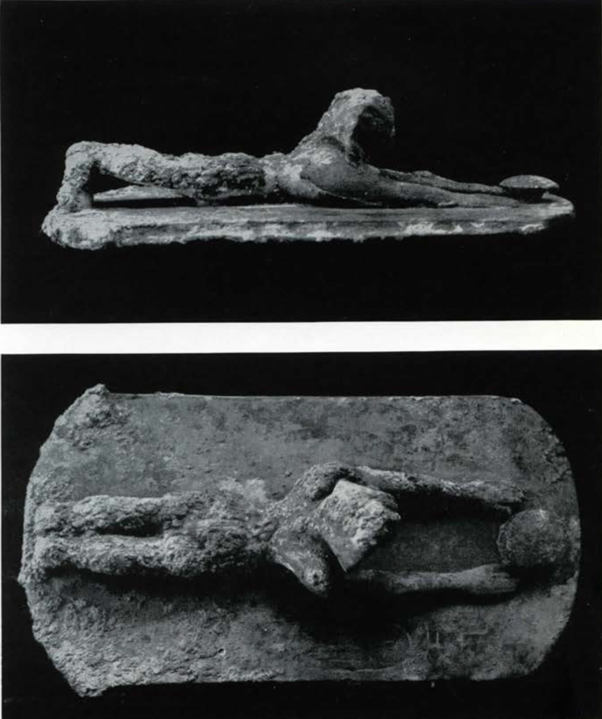 Top and bottom views of a prostrate figurine of King Sesostris.