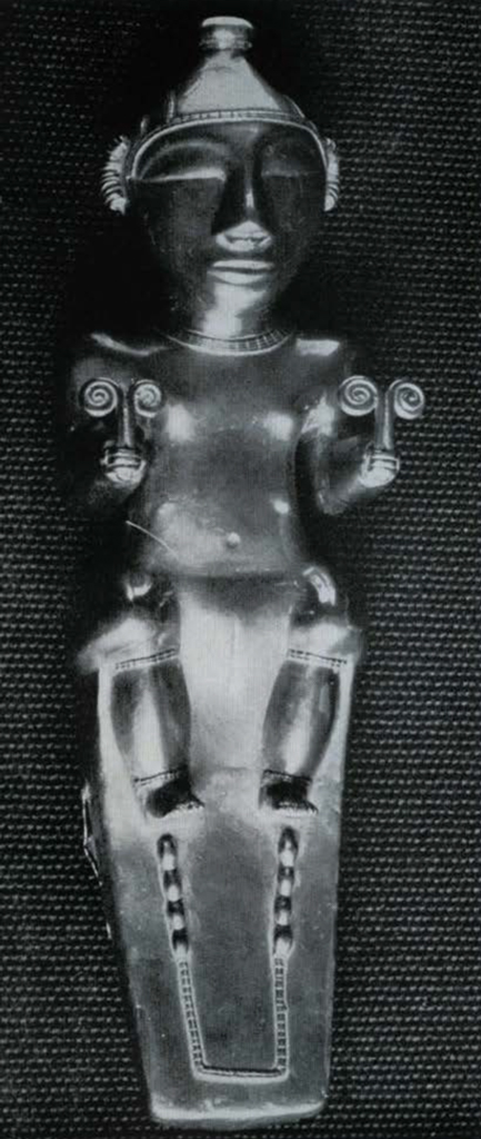 Flask in the shape of a human figurine formed from a thin sheet of cast gold, a seated female, arms bent at right angles with elbows next to the body and hands directly in front of them, each hand holds two stems with tightly coiled ends.