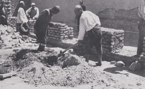 People laying brickwork.
