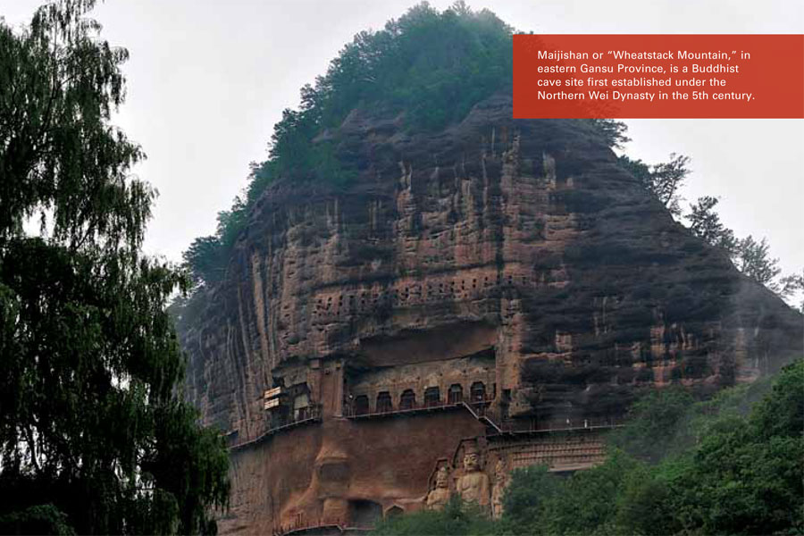 A Buddhist temple cut into a cliff face.