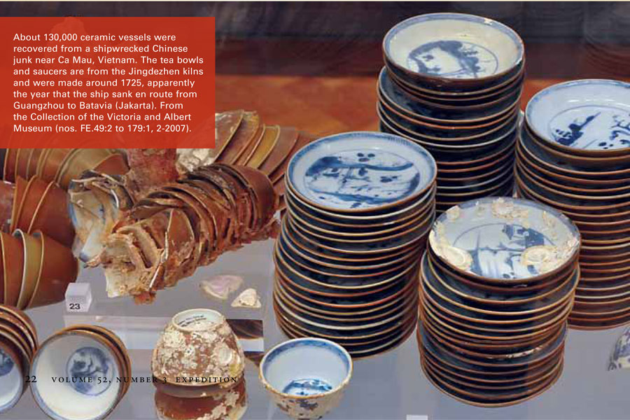 A collection of porcelain dishes stacked on top of each other, including plates, cups, and sherds.