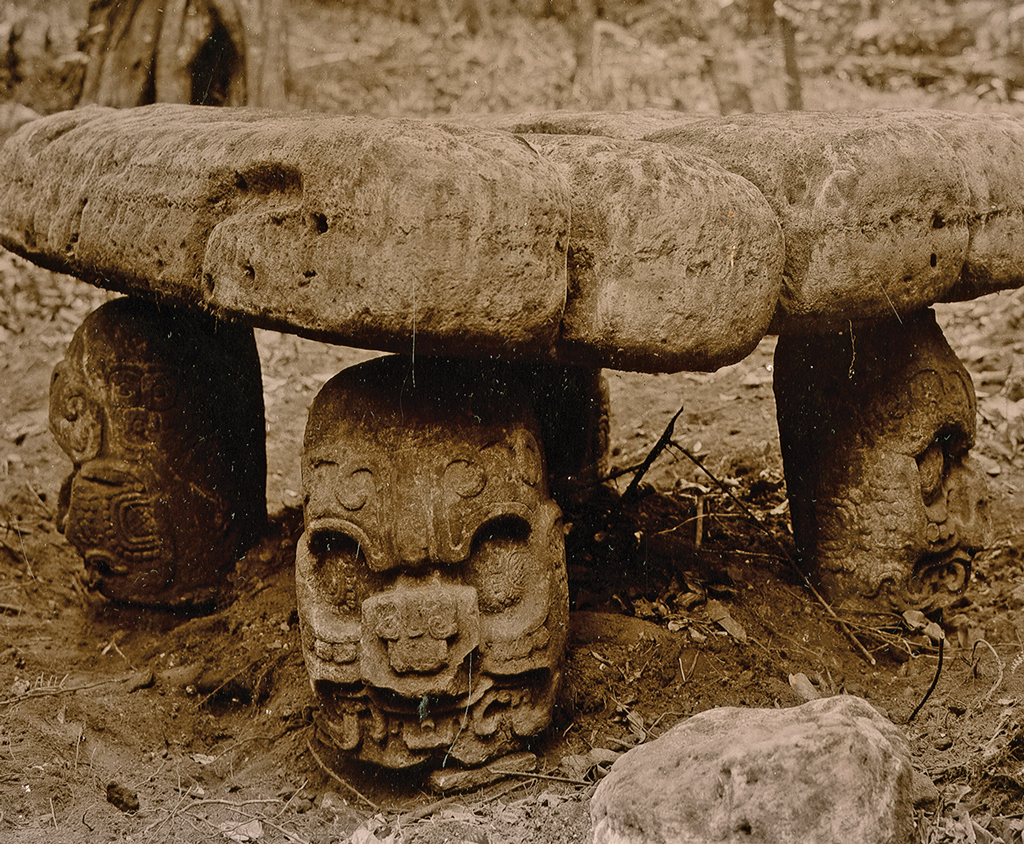 A low altar with legs in the shape of faces