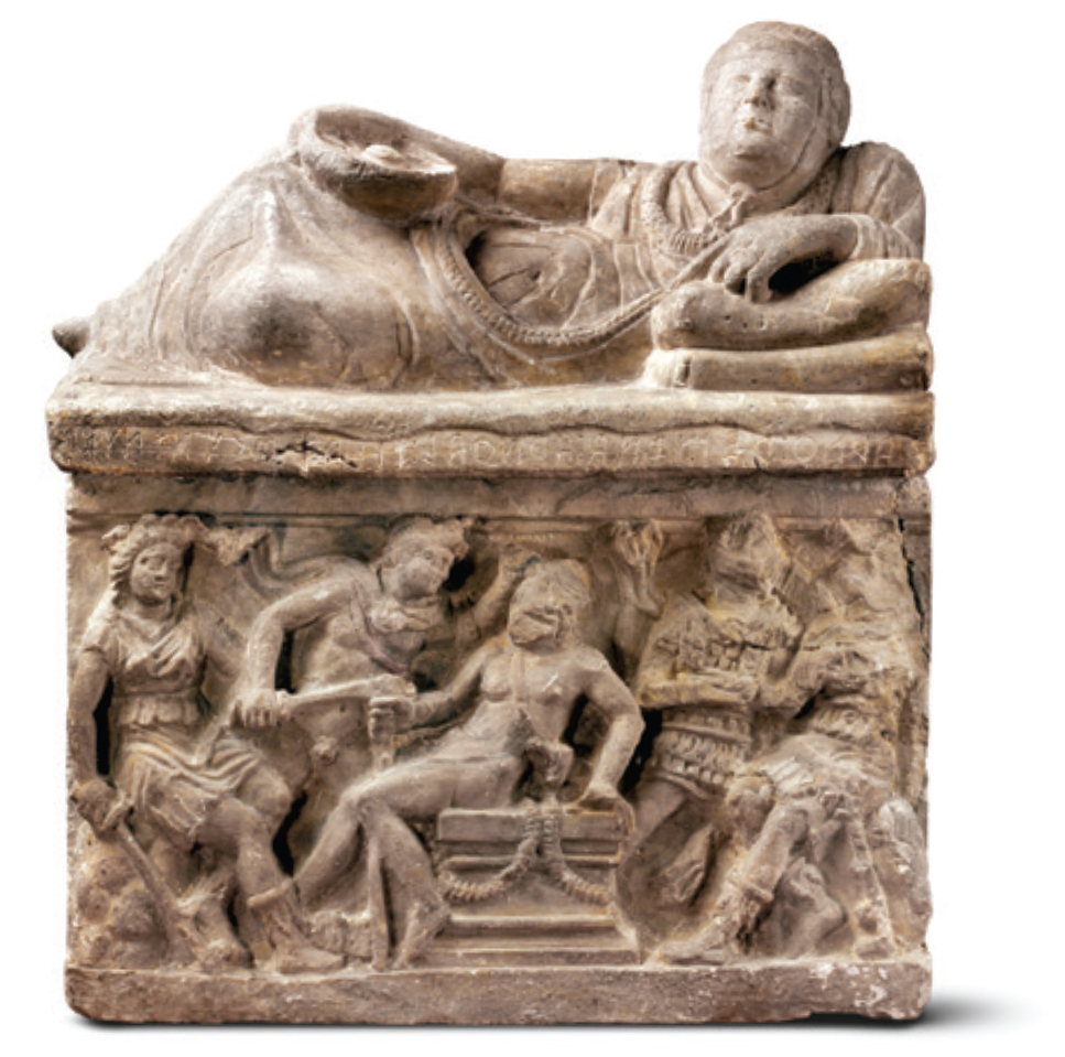 Carved stone chest, lid sculpted into the shape of a reclining man, chest showing the Murder of Aegistheus in high relief