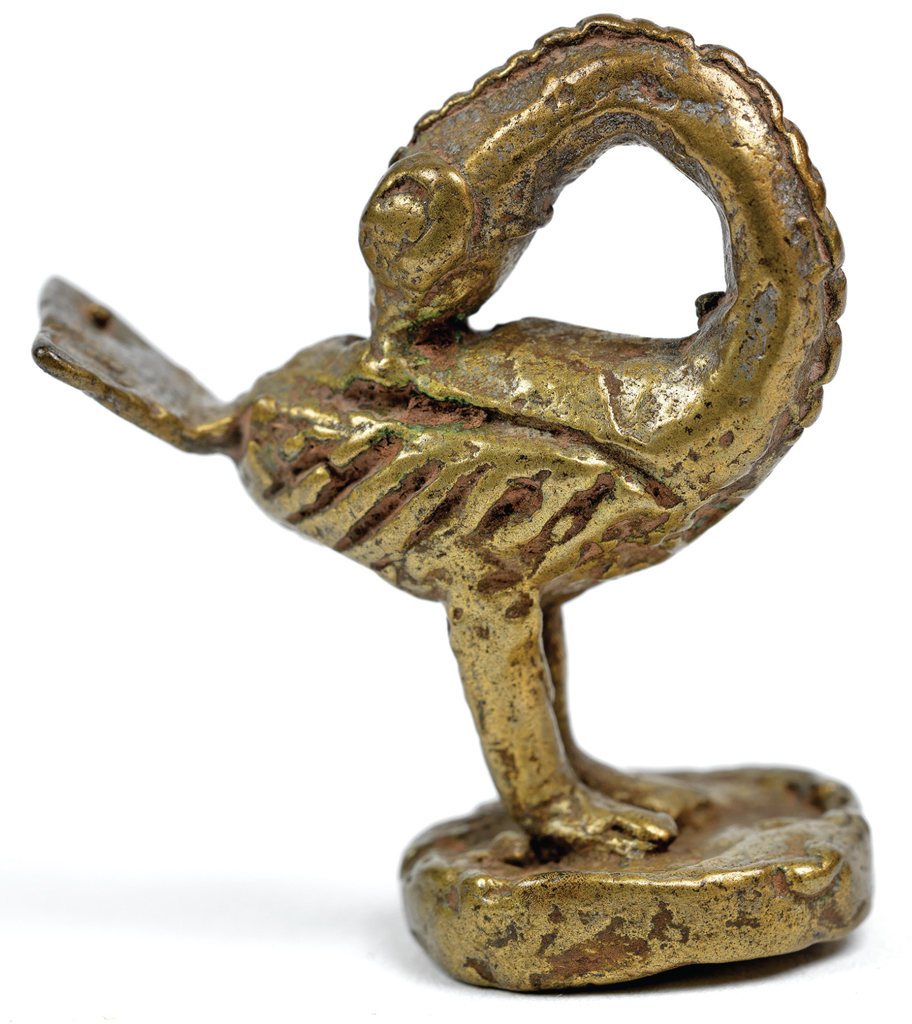 Gold weight in the shape of a bird with its neck arching to touch its beak to its back.