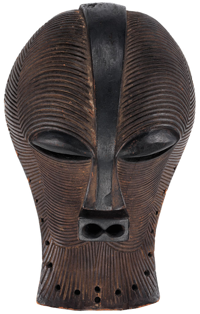 A wooden mask decorated with striations.