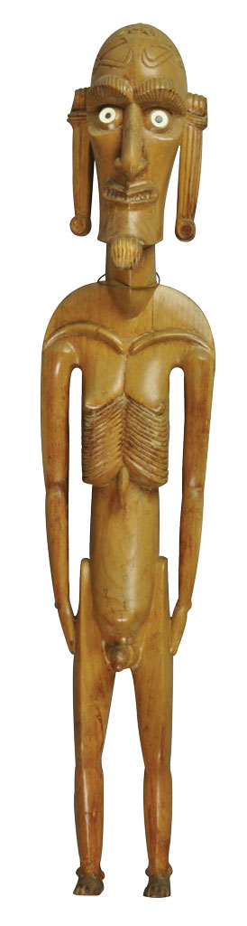 A wood carved figure of a person with prominent ribs.