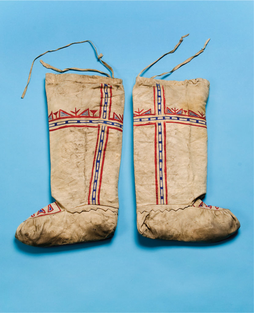 A pair of boots with red and white painted decoration.