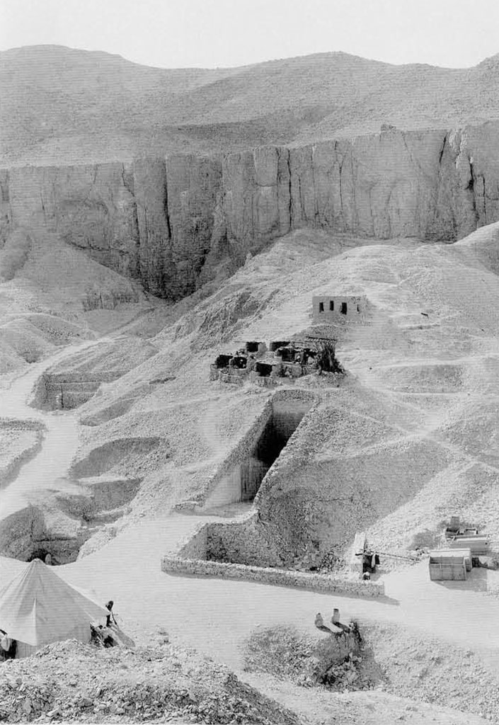 A massive mound of sand with the entrances to tombs dug out of it.