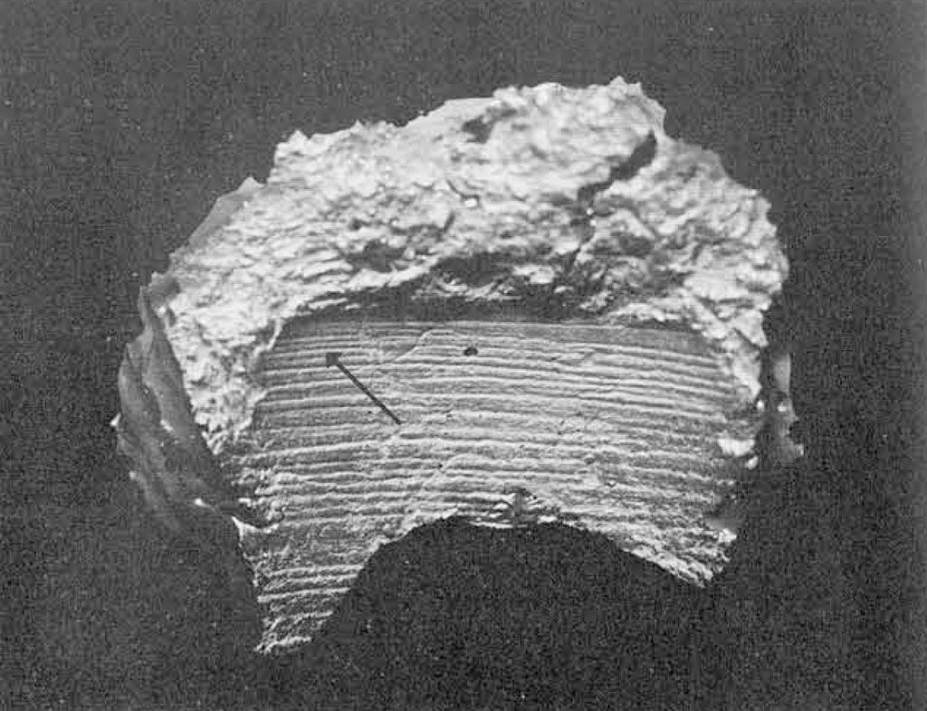 Close up of model of drill hole showing lines growing closer togeter towards the top.