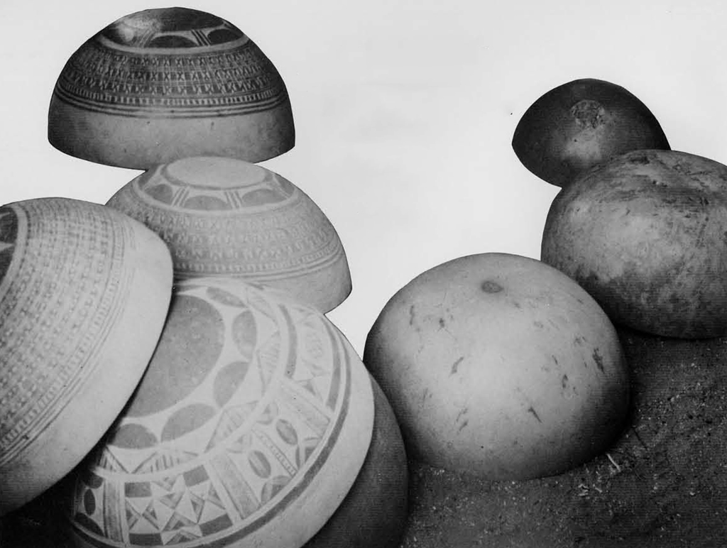 A pile of calabashes, some with designs on the outside, some plain.