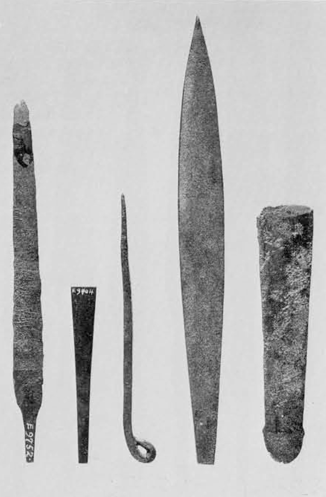 Five flat metal tools.