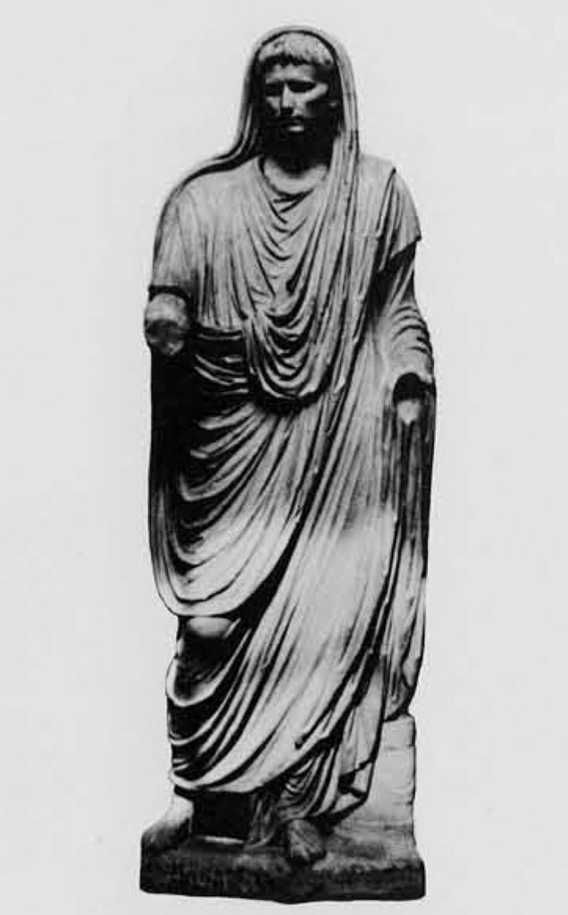 Statue of Augustus in draping toga, a hood pulled up, arms broken off at the elbow.