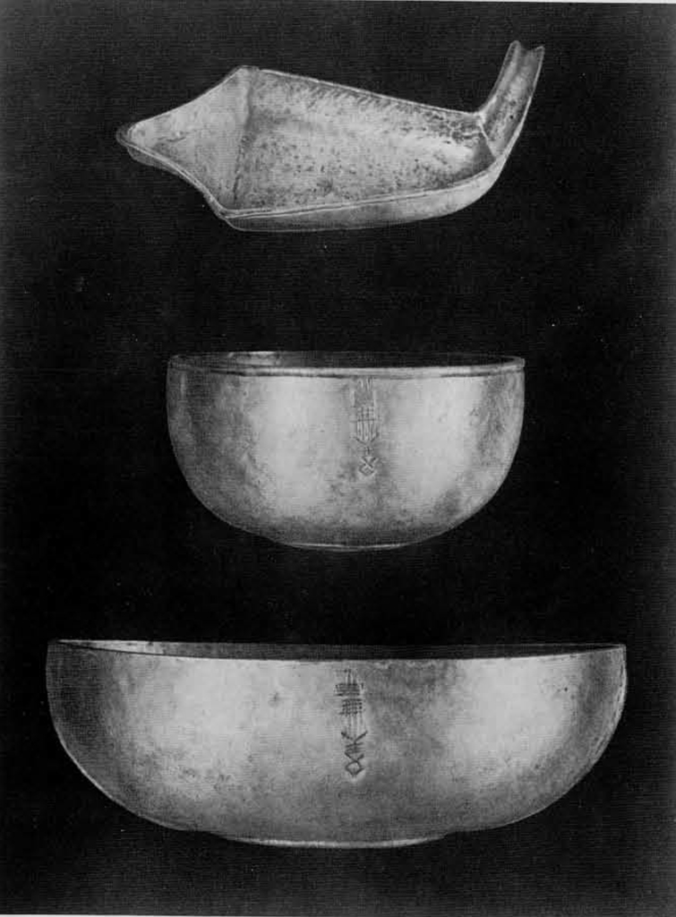 Two bowls and a pouring vessel.