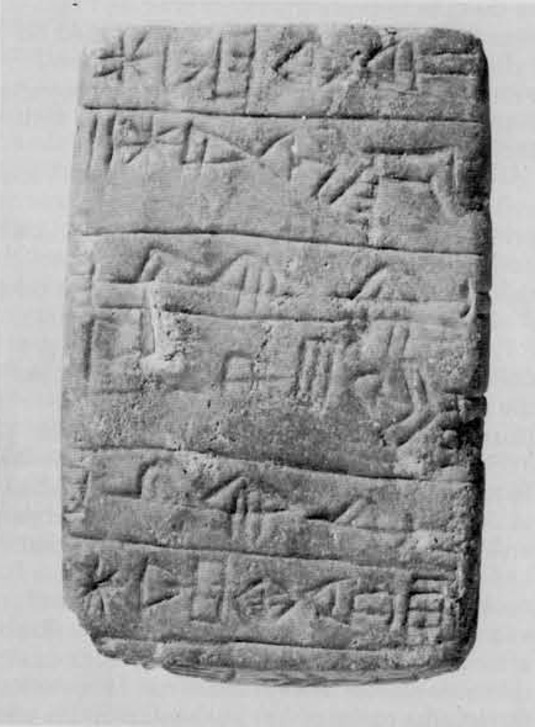 A tablet with rows of cuneiform inscription.