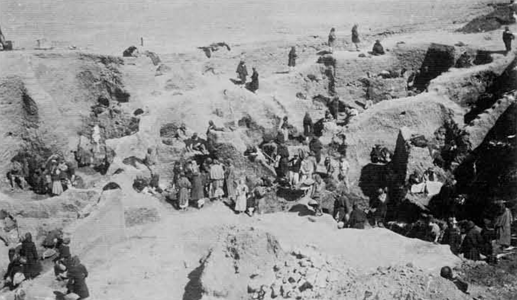 Groups of people excavating the cemetery at various levels.