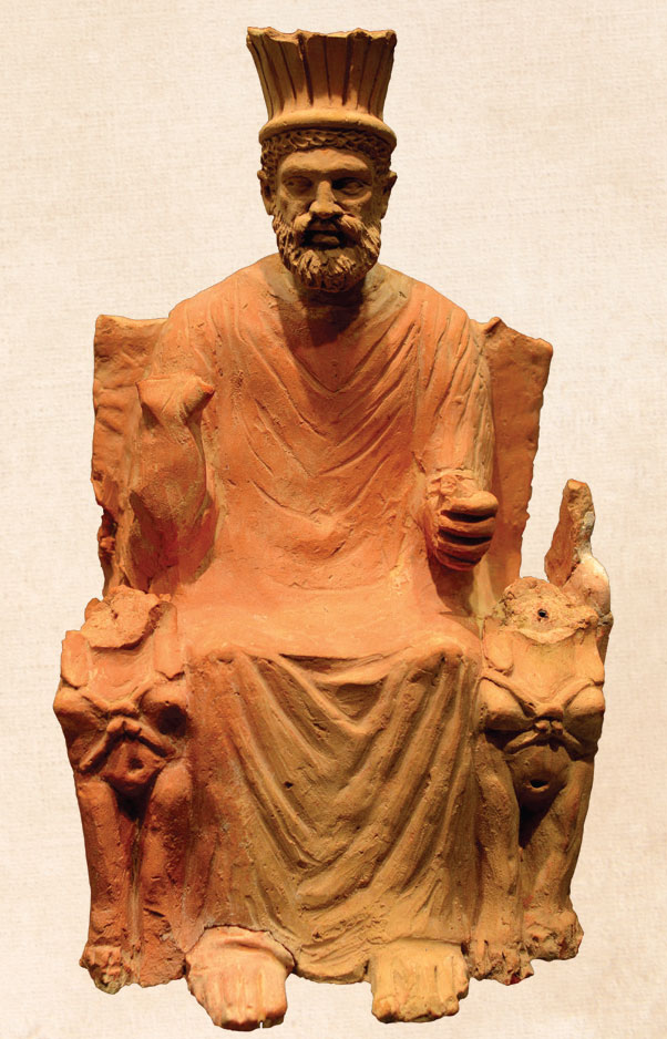 Terra cotta statuette of Baal-Hammon seated on his throne, flanked by sphinxes.