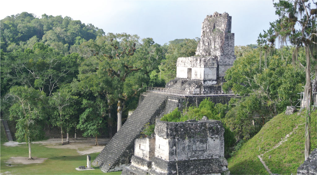 Temple 2 of Tikal, with steep stairs rising from a clearing.