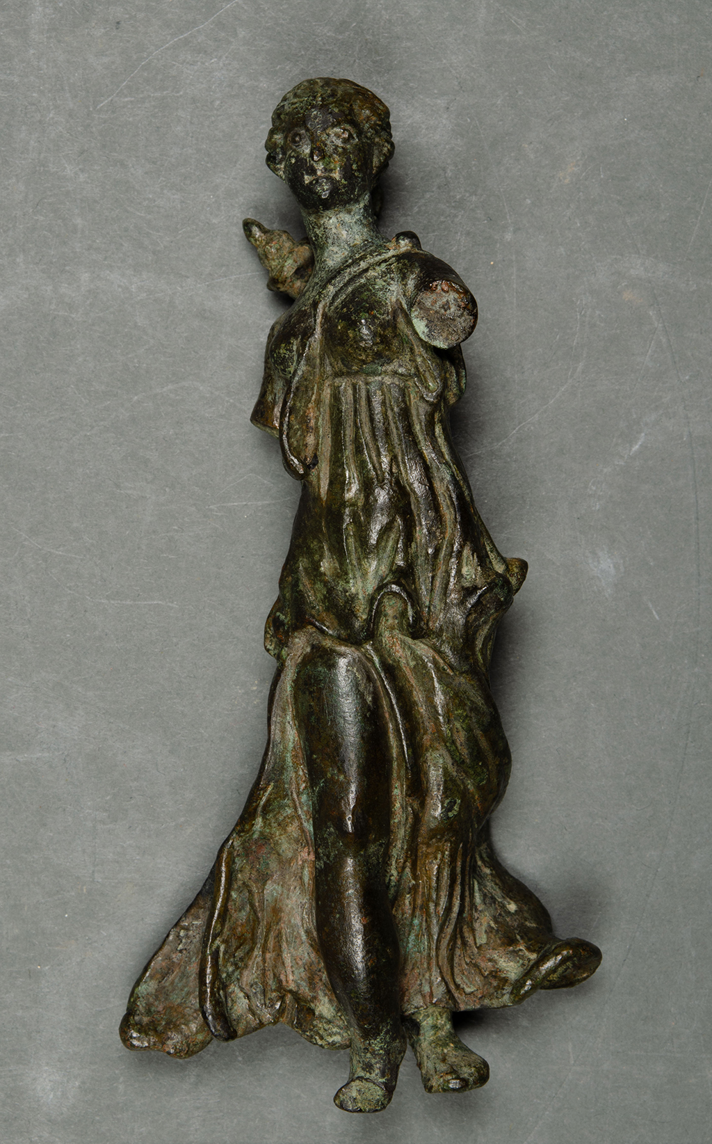 A copper alloy figurine.