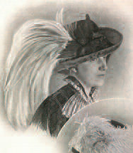 Woman wearing feathered hat.