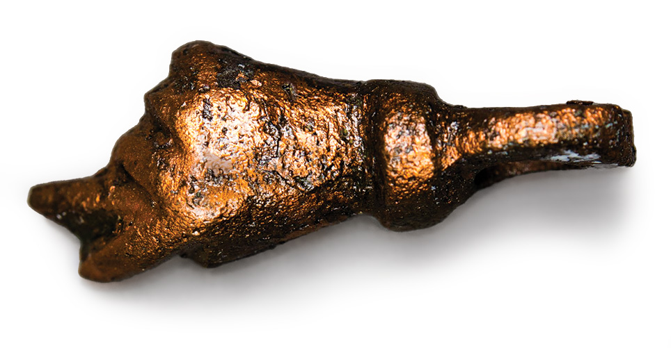 A bronze amulet shaped like a fist.
