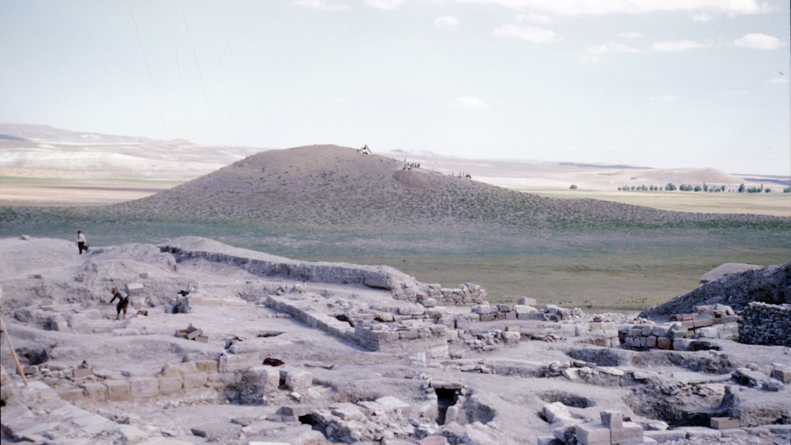 The excavations at Gordion, with a massive mound in the distance.