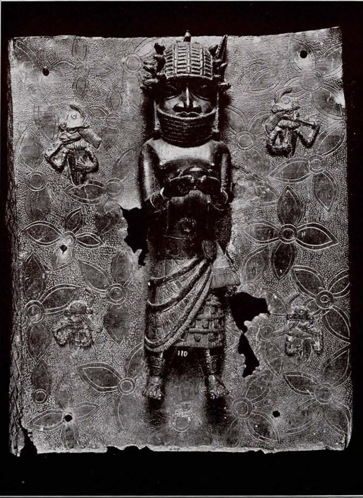 bronze plaque of a noble in full head gear presenting a gift in relief