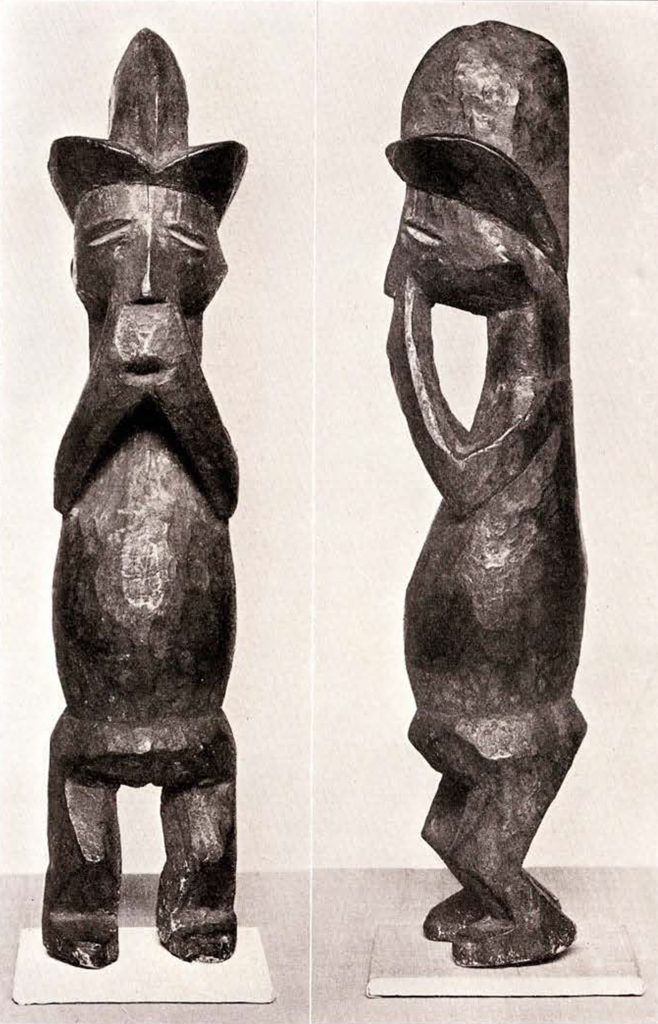 Roughly carved wood figure standing with tri crested headpiece, front and side views