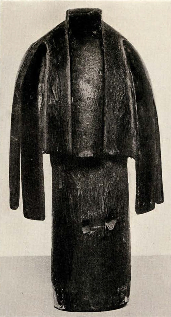Wood head with long neck, four long wide hair pieces hanging down, and one short wide hair piece along the crest, from the back