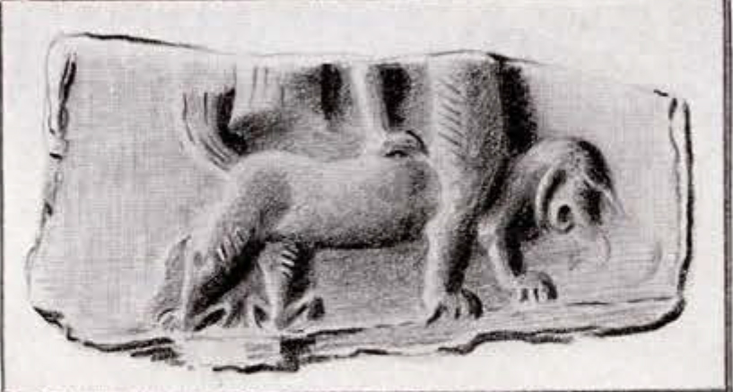 seal impression of a cut off figure's feat standing atop a griffon or dragon