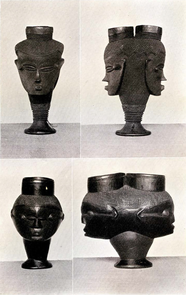 Front and side views of two wood cups, each with a mirroed full head and face carved on opposite sides with two openings at the top