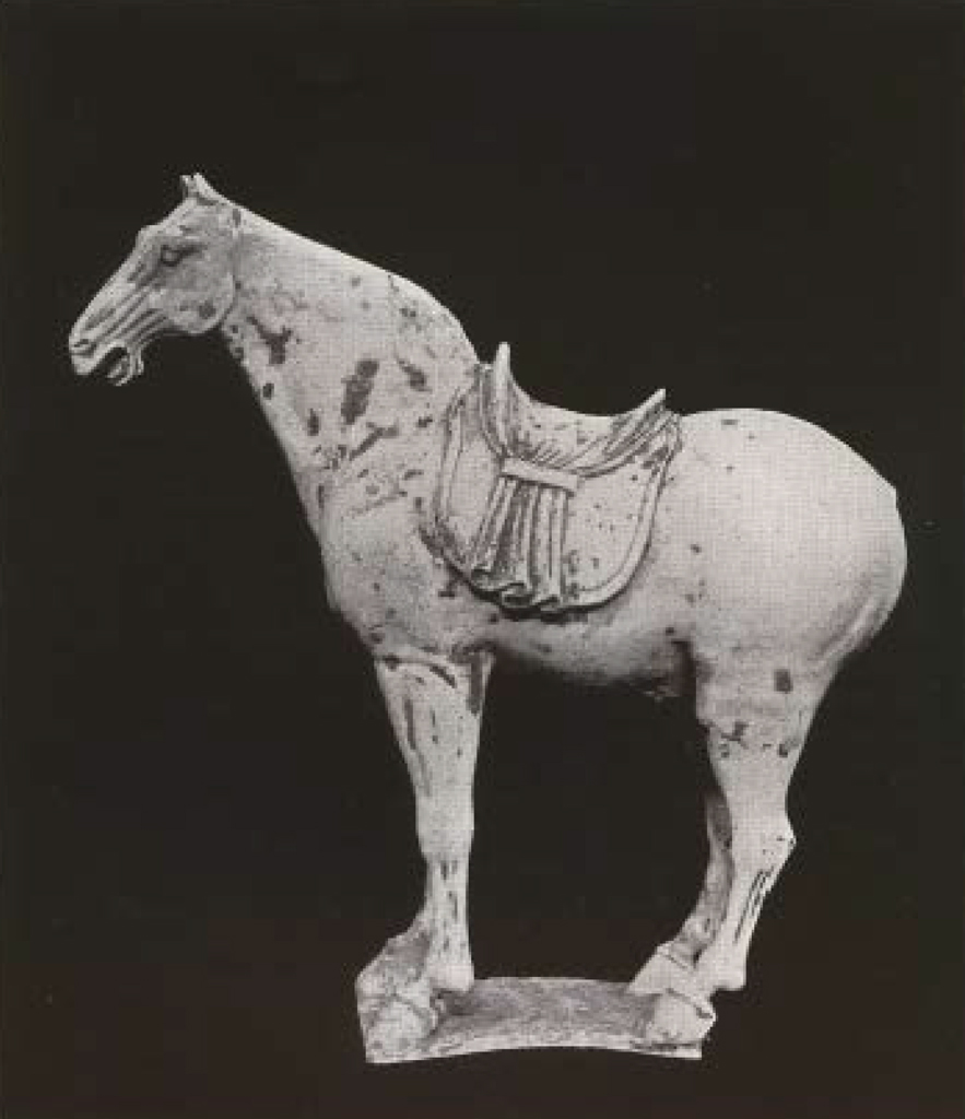 Unglazed clay standing horse figure with saddle but no mane or tail