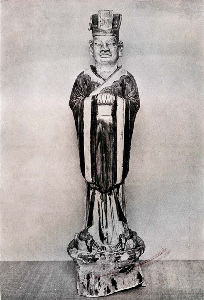 Pottery figurine of a high ranking official with hands clasped wearing garment with long draped sleeves and a square headpiece