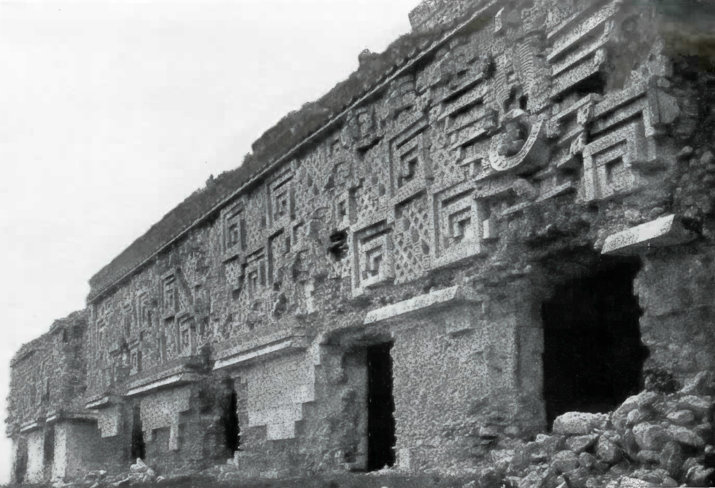 Geometric carved facade of a building with several entrances