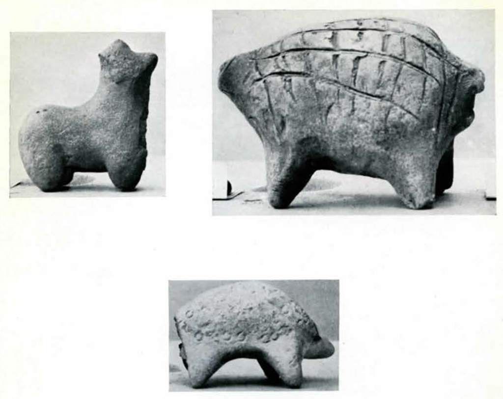 Three animal figures, two of which have large rounded bodies with impressed patterns on the backs