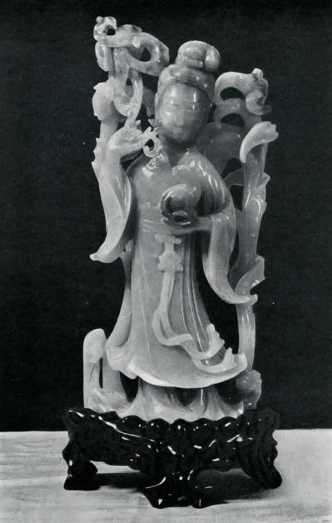 Jade statue of a woman holding a hare or rabbit in one hand