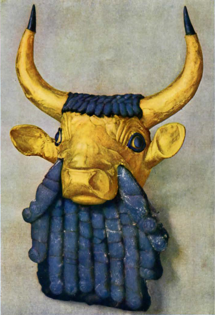 Gold bulls head and horns with blue beard and hair atop his head