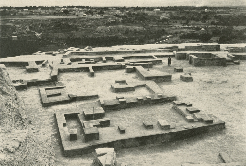 Excavated temple with low foundational walls showing layout