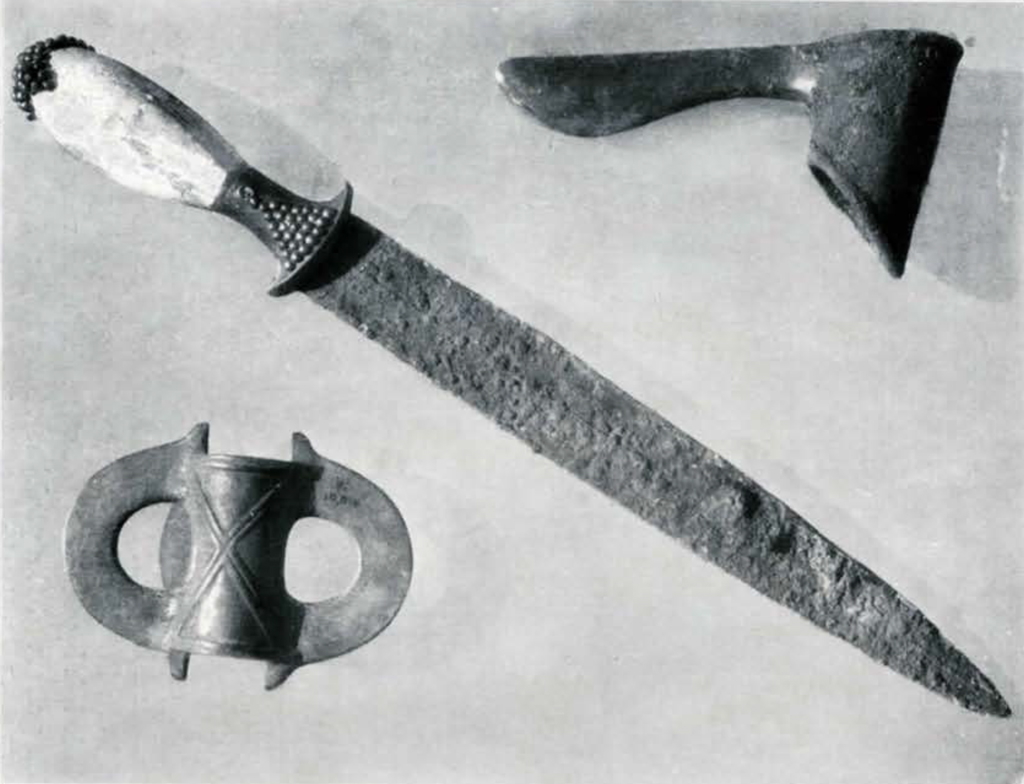 Dagger with studded hilt and corroded blade, and two axe heads