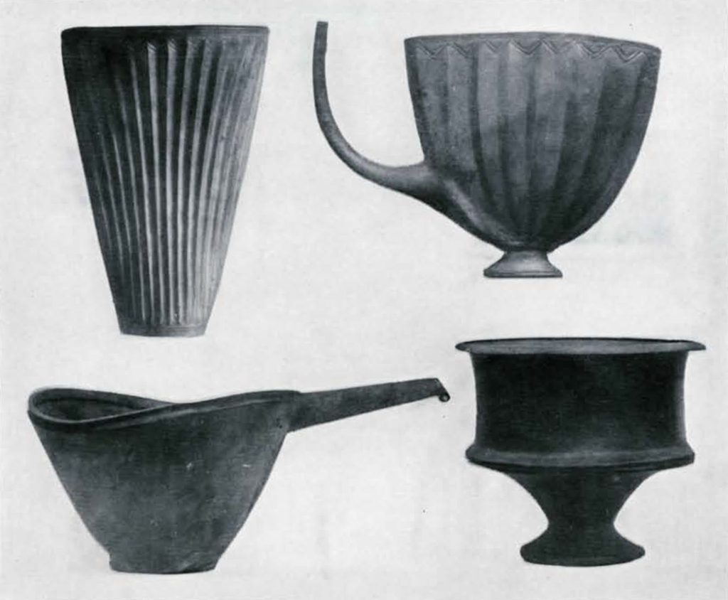 Four vessels, two fluted, two with spouts