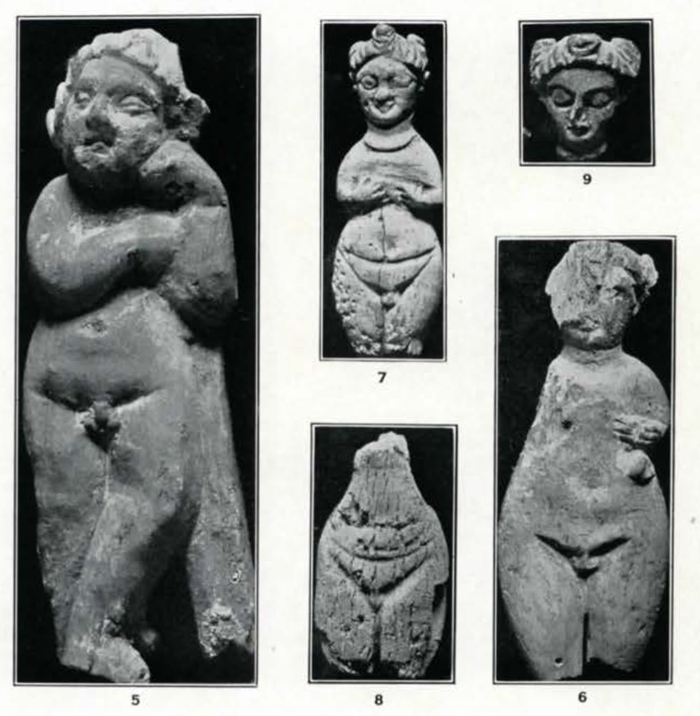 Several small figurines of nude women with curly hair and big hips