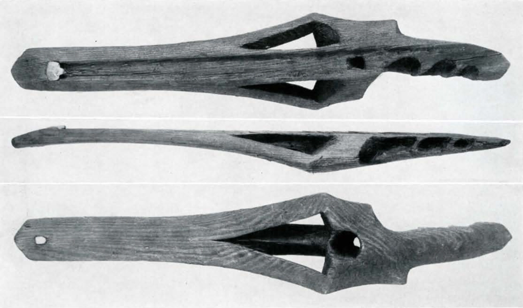 Wooden spearthrower, top, bottom, and side views
