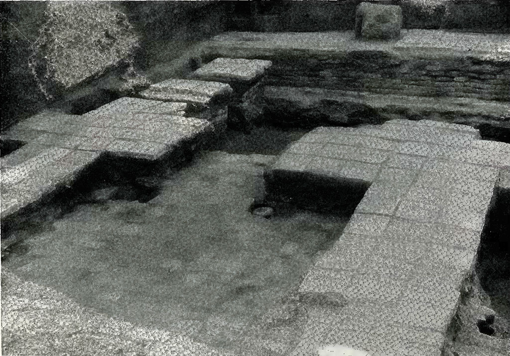 Two levels of excavated pavement made of square tiles